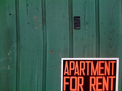 Apartment for rent sign on wall