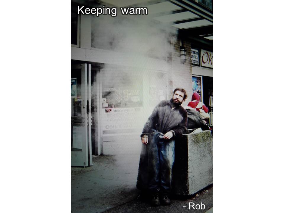 Man keeping warm with a steam vent