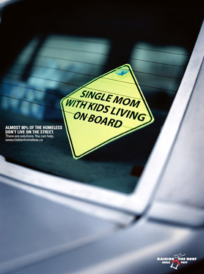 "Single mom with kids living on board" sticker on a car. Raising the Roof image.