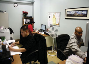 3 men working at their desk