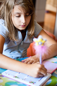 An image of a little girl studying